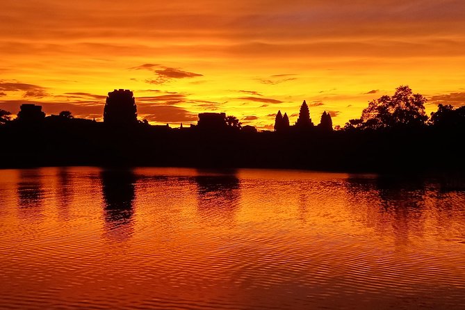 A Day Angkor Wat Sunrise Tour, Ta Prohm & Hidden Gems Beng Mealea - Bayon and the stone faces of Angkor Thom