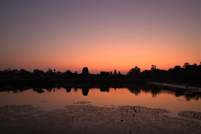 Angkor Sunrise Expedition Cycling Through Serene Backroads - Angkor Thom’s wall, moat, and jungle
