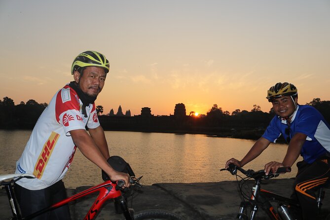 Angkor Sunrise Expedition Cycling Through Serene Backroads - The Bayon and its many stone faces