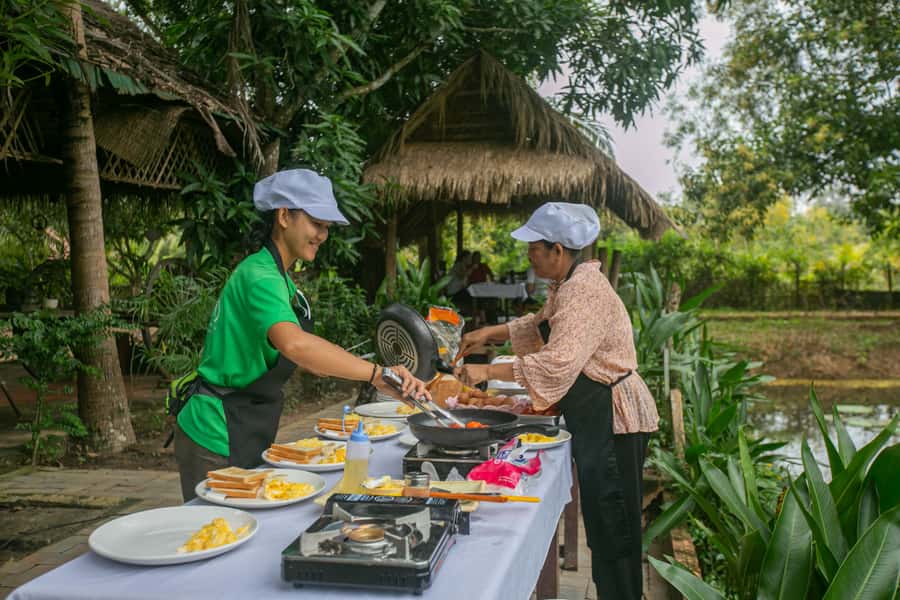 Angkor Wat: Guided Sunrise Bike Tour w/ Breakfast and Lunch - Preah Khan and Ta Prohm among the trees