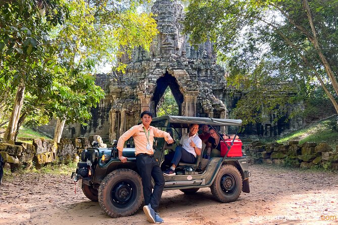 Angkor Wat Sunrise and Market Tour by Jeep - Ta Prohm, where trees meet stone