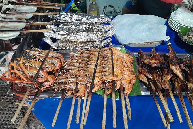 Evening Cambodian Food Tour - Independence Monument after dark