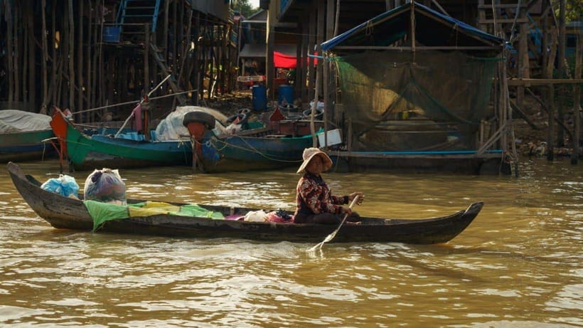 From Siem Reap: Kampong Phluk Floating Village Tour by Boat - Walking through the stilted village