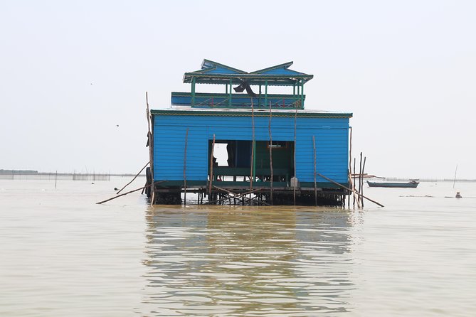 Guided Floating Village Boat Tour in Siem Reap - Boarding the traditional long-tail boat