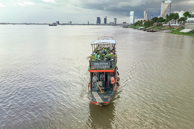 Phnom Penh Bike & Boat Sunset Tour / E-Bike Available - Seeing silk made at the Silk Island Community Center