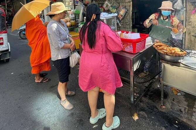 Phnom Penh Morning Breakfast, Market and Art Tour by Tuktuk - Noodle soup and coffee at a family restaurant