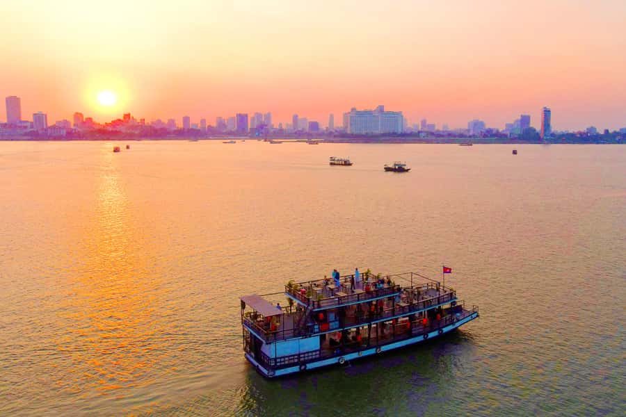 Phnom Penh: Sunset Cruise with Unlimited Beer &Fruit platter - The outward run: bridges, temples, and royal Phnom Penh