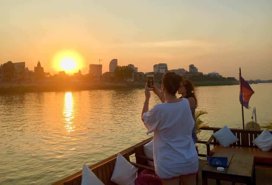 Phnom Penh: Sunset Cruise with Unlimited Beer &Fruit platter - The Four Faces River and the city’s working edge