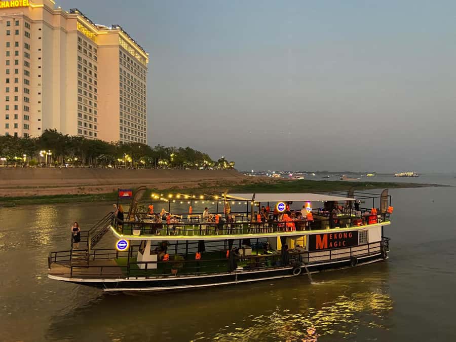 Phnom Penh: Sunset Cruise with Unlimited Beers & BBQ Buffet - Boarding the boat and settling in