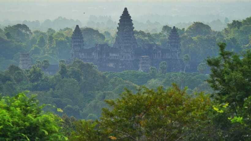 Shared day tour with Spanish-speaking guide at Angkor Temple. - Ta Prohm trades symmetry for jungle atmosphere