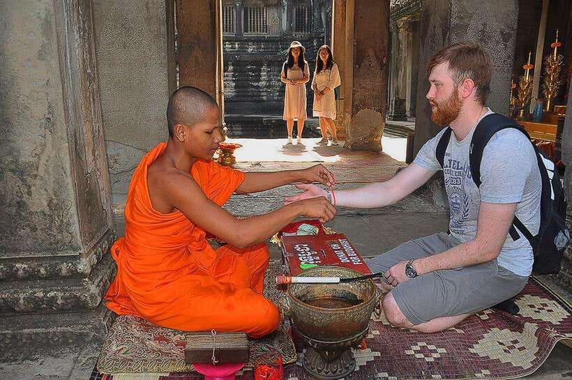 Siem Reap Cambodian Buddhist Water Blessing and Local Market - The temple stop and the important name check