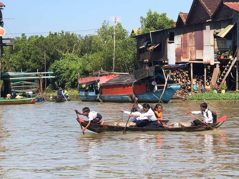 Siem Reap Floating Village Kampong Phluk Sunset with Boat - Walking through the stilted village