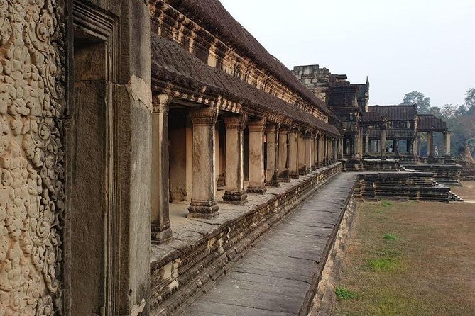 Sunrise Tour of Angkor Temples from Siem Reap - Bayon’s stone faces and narrow corridors