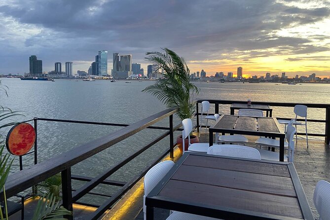 Sunset Cruise with free flow beer, soft drinks & fruit platter - Riverbank homes, fishermen, and the working Mekong