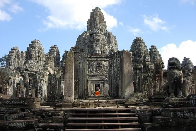 The Angkor Temples from Sunrise by Tuk Tuk - Bayon Temple and the faces of Angkor