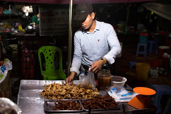 Ultimate Phnom Penh Food Tour by Tuk Tuk: 20 Tastings and Drinks - Stop four: Russian Market after dark